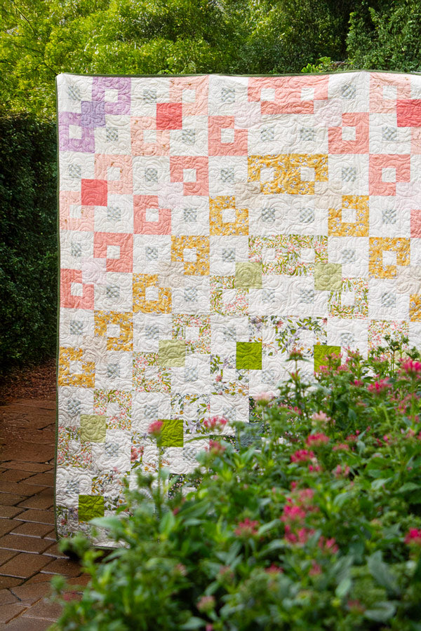 Colorful summer quilt fabric palette flat lay