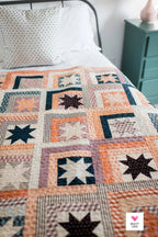 Another colorway of Log Cabin Stars by Quilty Love