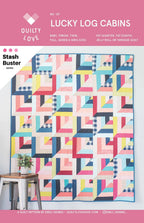 Quilt pattern cover for 'Lucky Log Cabins' by Quilty Love with colorful geometric quilt design.