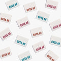 Cute AF! Woven Labels by KATM in colorful embroidered text.