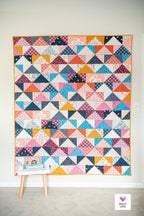 Patchwork Flying Geese Quilt Pattern by Quilty Love | Stash Buster Quilt Pattern