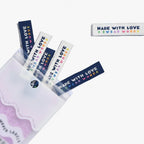 Small rectangular labels with 'Made with Love' text in various colors on a white background. KATM Labels