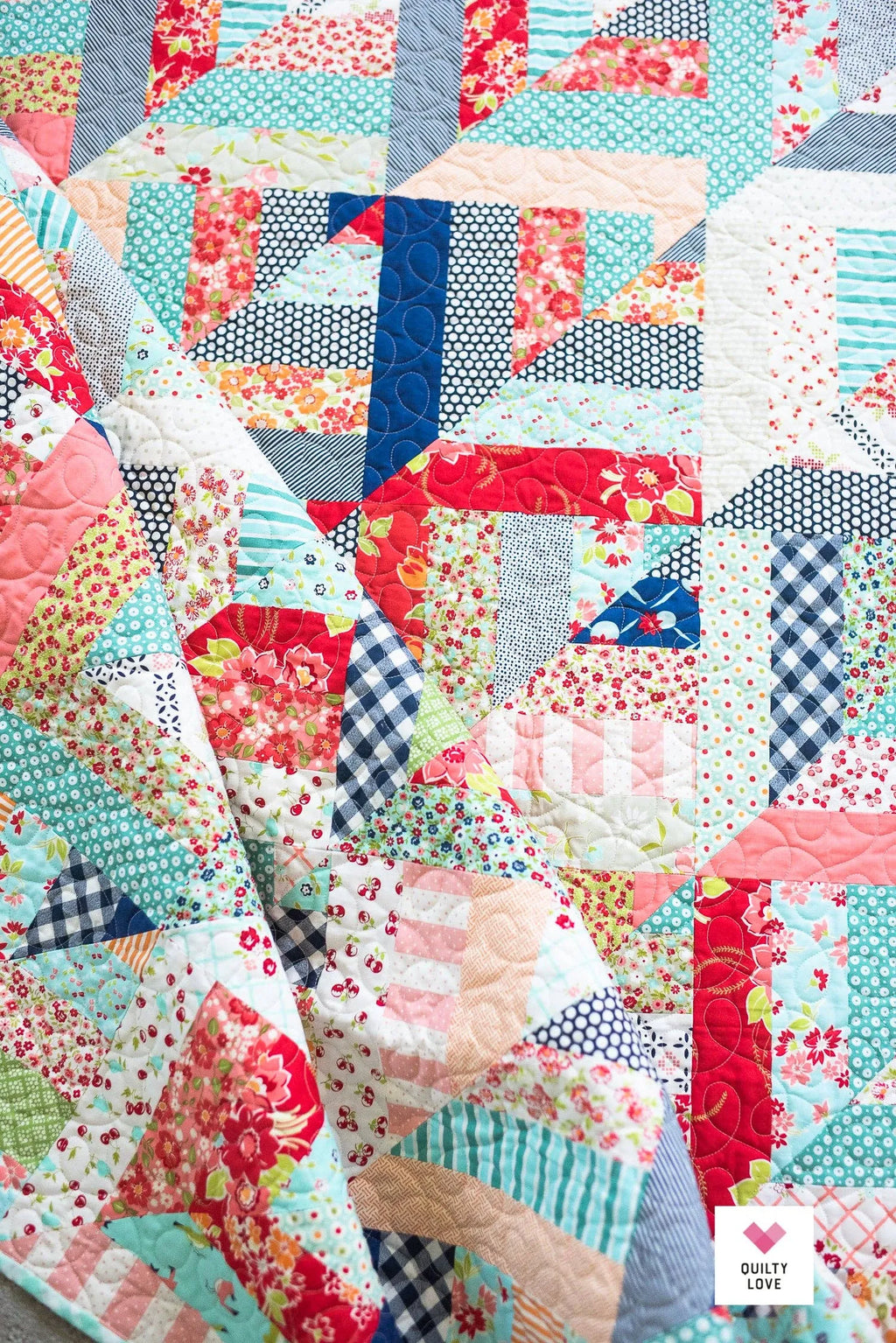 Colorful patchwork quilt with various patterns and colors. Lucky Log Cabin by Quilty Love