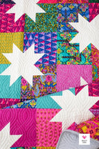 Closeup of Scrappy Sawtooth Star Quilt pattern Star Pop II by Quilty Love