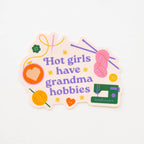 Sticker with text 'Hot girls have grandma hobbies' and colorful graphics on a white background from Sarah Hearts