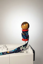 Binding Babies Ana on a sewing machine spool