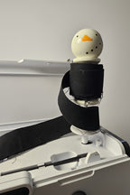 Binding Babies Snowman on a sewing machine spool