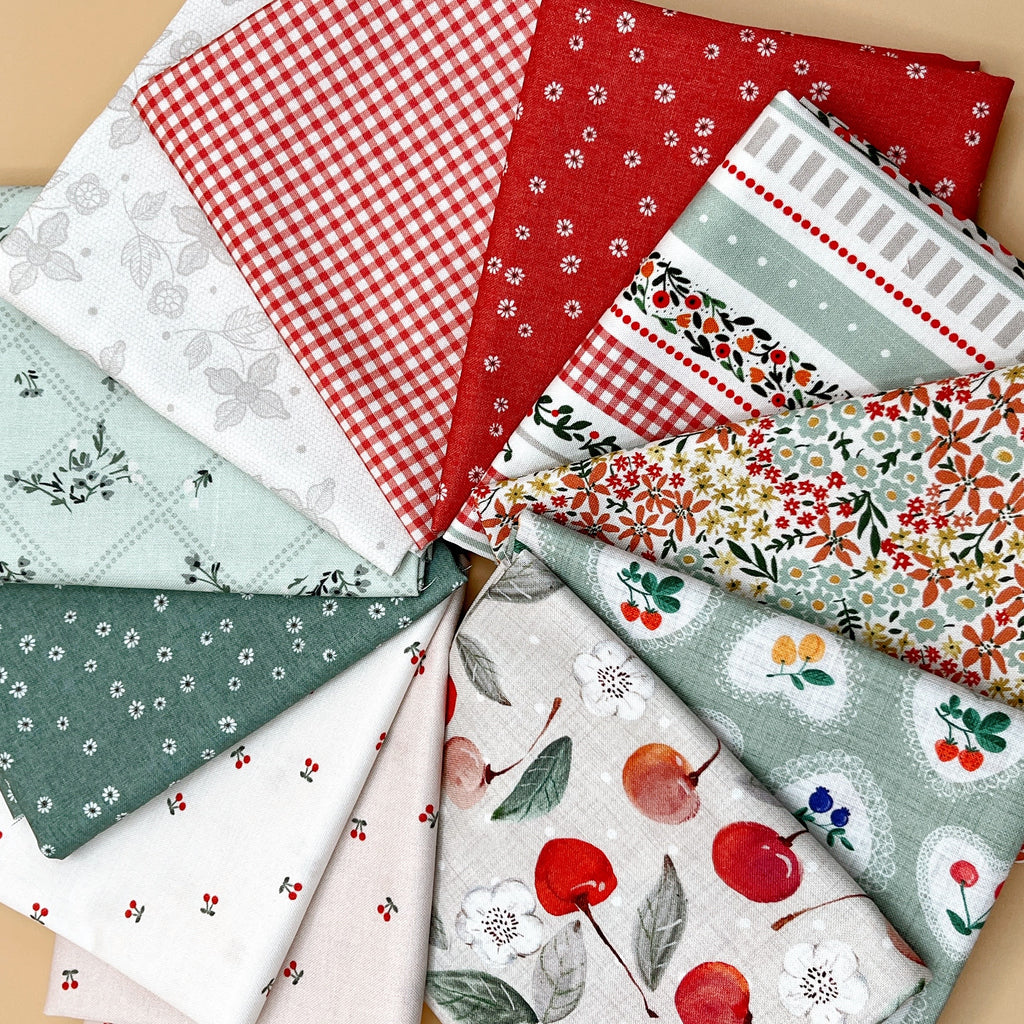 Cherry Orchard 11-piece fat quarter bundle by Bernadett Urbanovics for FIGO Fabrics featuring vintage cherries, florals, gingham and coordinating quilting prints