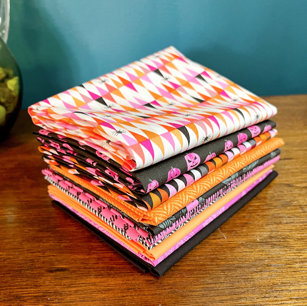 Stack of Quilting Cotton prints from the Enshadow Collection