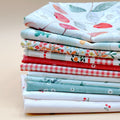 Cherry Orchard 11-piece fat quarter bundle by Bernadett Urbanovics for FIGO Fabrics featuring vintage cherries, florals, gingham and coordinating quilting prints