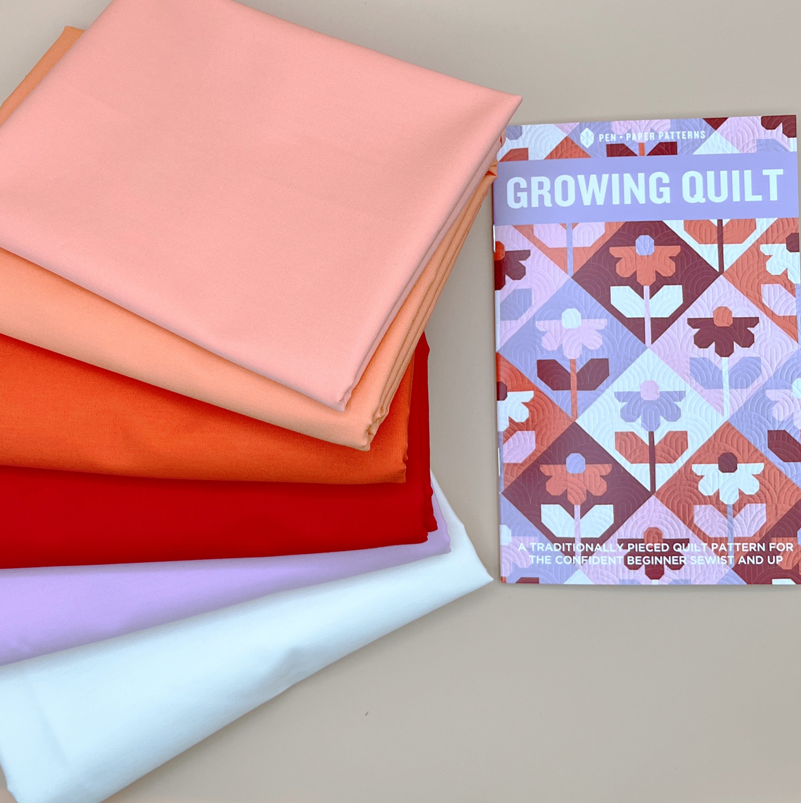 Growing Pen + Paper Quilt Kit with Art Gallery Pure Solids in Reds, Oranges and  Purple Pinks
