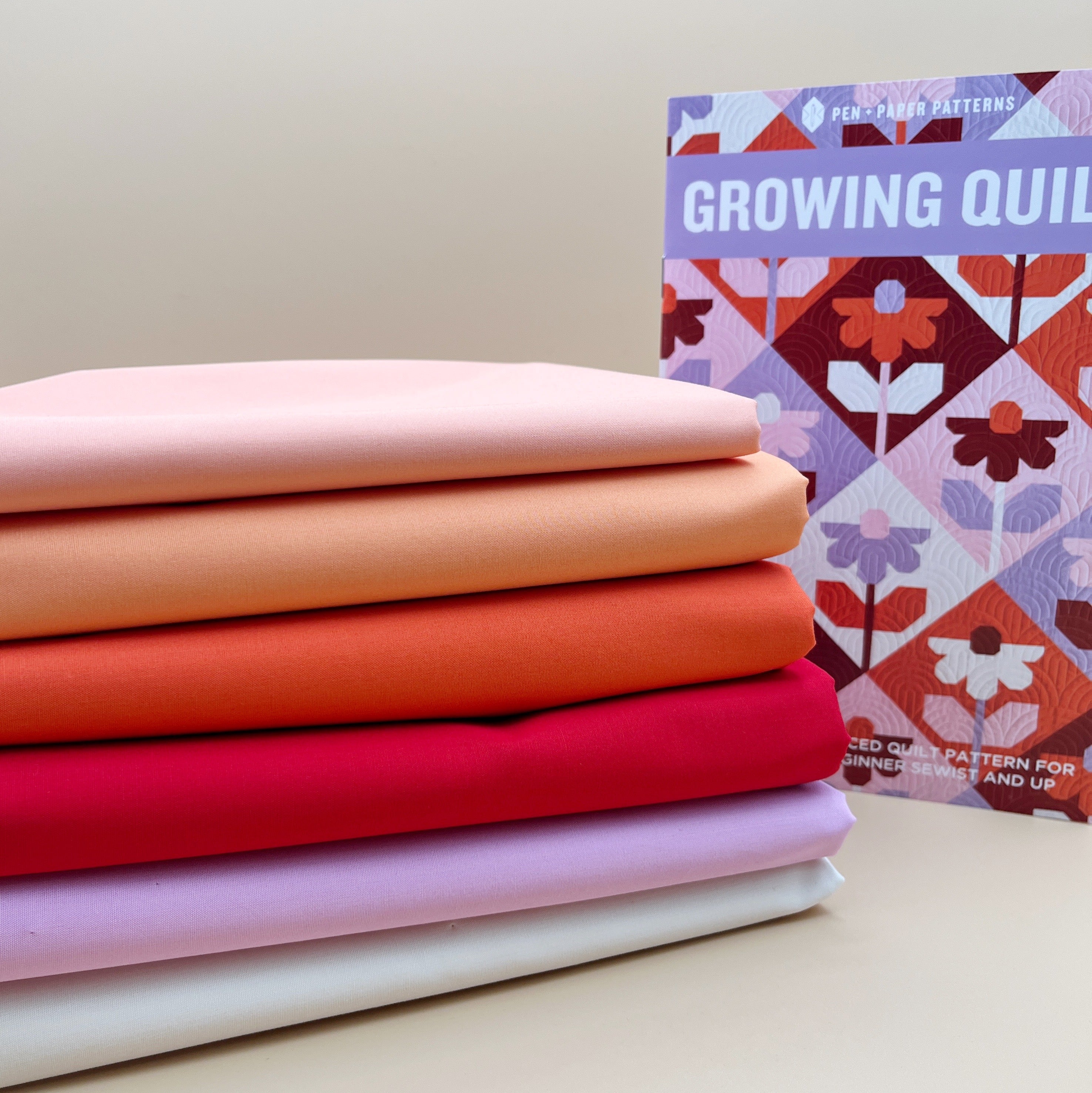 Growing Pen + Paper Quilt Kit with Art Gallery Pure Solids in Reds, Oranges and  Purple Pinks