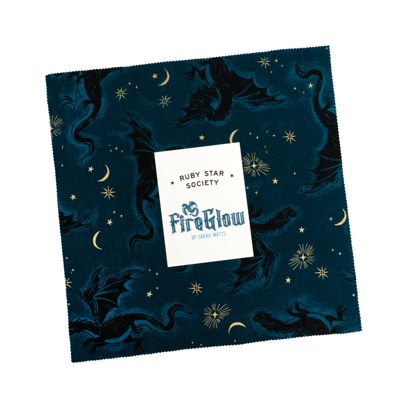 Stack of 10-inch Fireglow fabric squares with red dragons, green scrollwork, and teal scales,