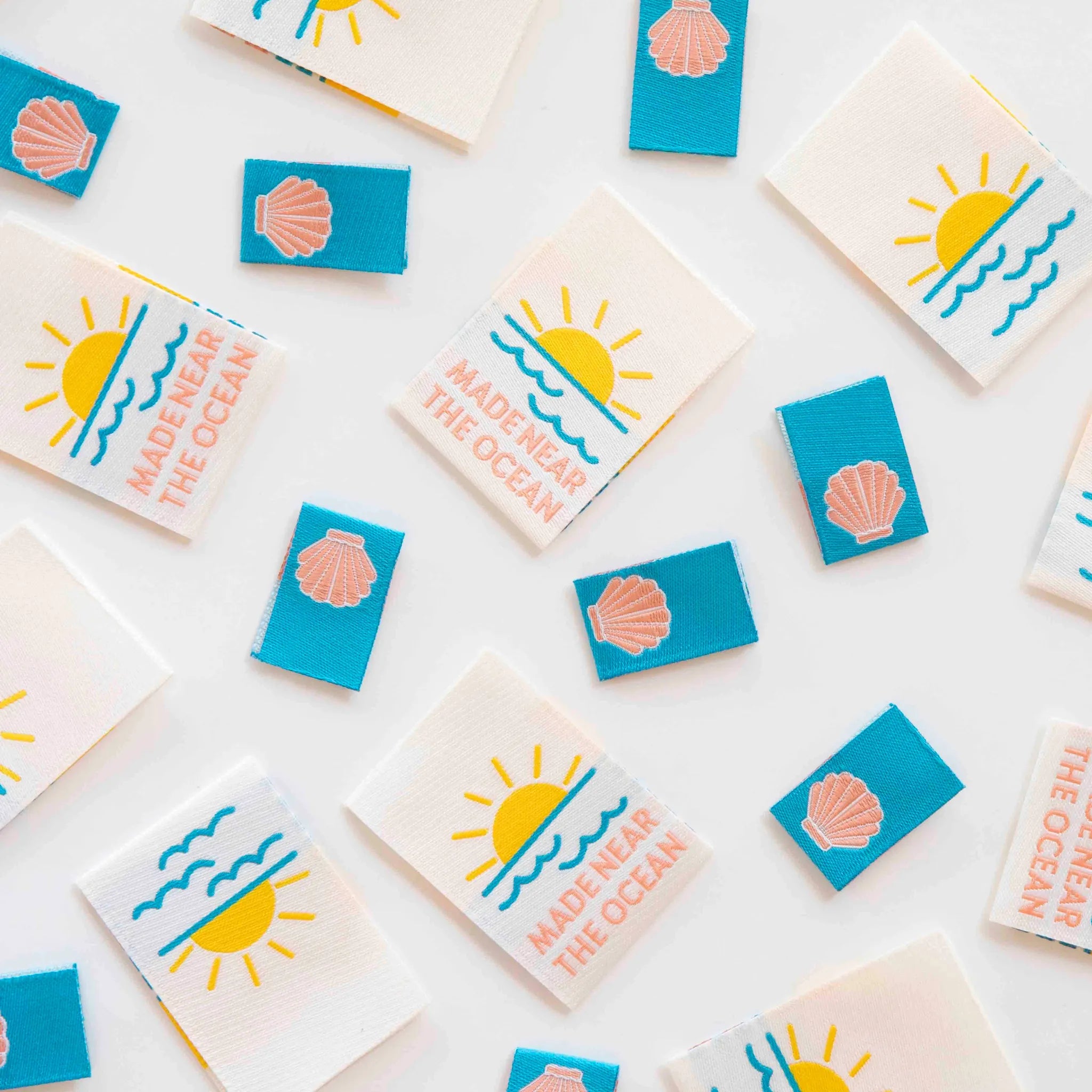 Sarah Hearts Woven Labels with ocean-themed designs on a white background