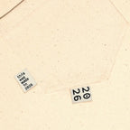 Circa 2026 Woven Labels by KATM on beige fabric.