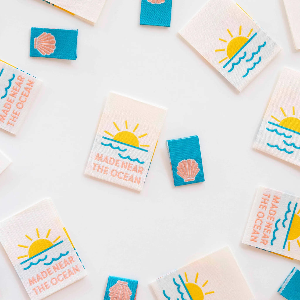 Small rectangular cards with ocean-themed designs and 'Made near the Ocean' text on a white background. Sarah Hearts