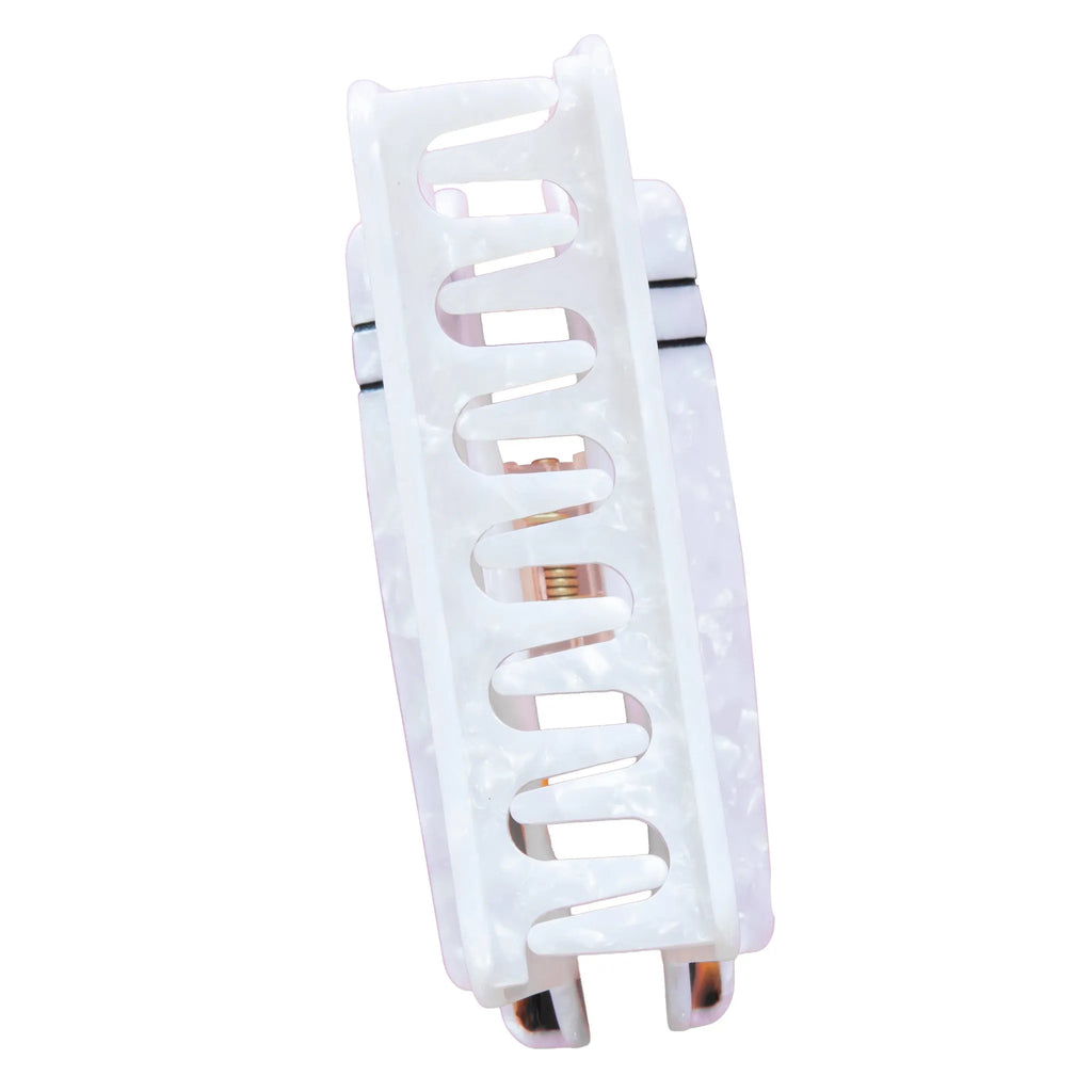 White hair clip with rose gold accents on a white background