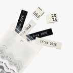 Circa 2026 Woven Labels by KATM in black and white designs.
