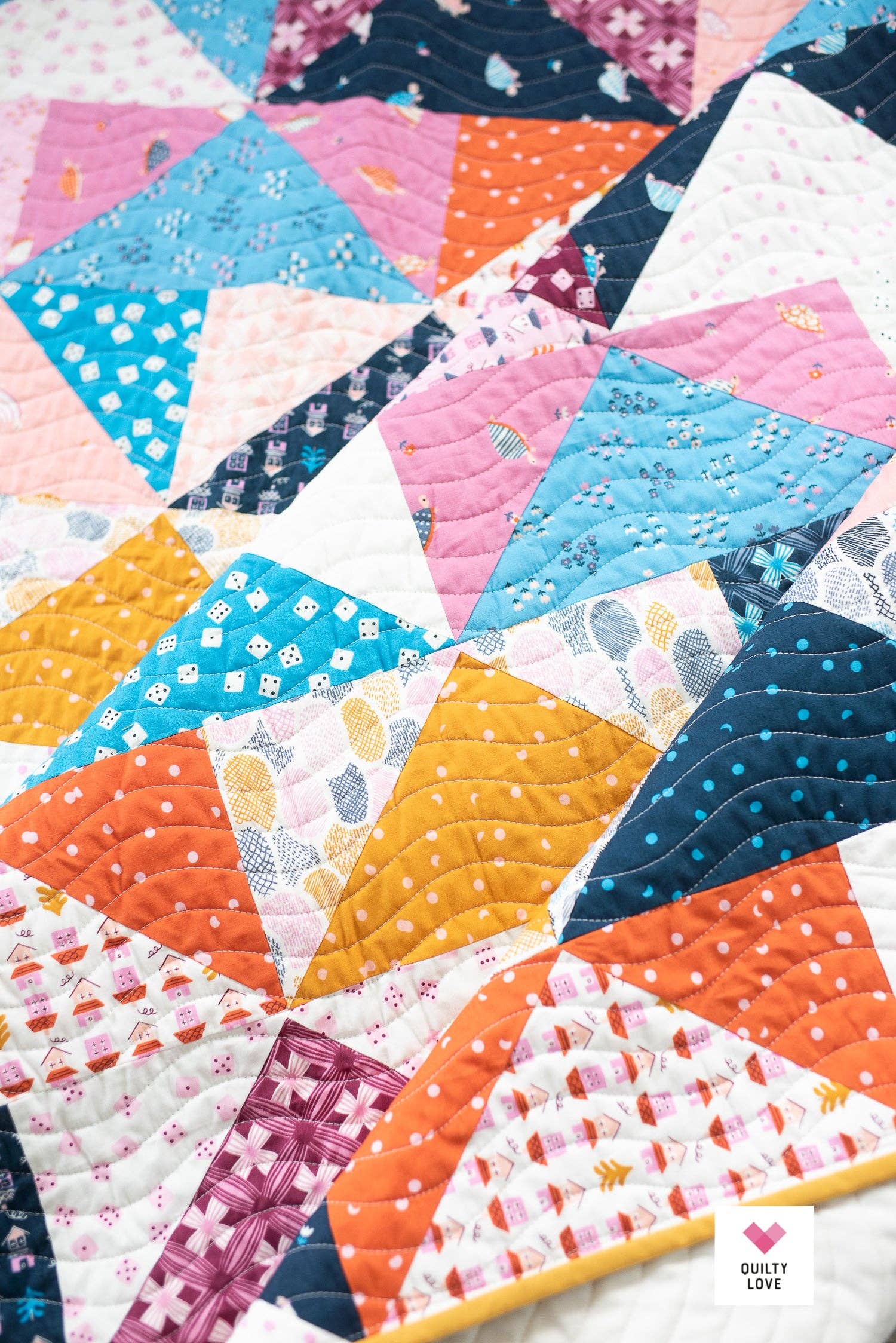 Patchwork Flying Geese Quilt Pattern by Quilty Love | Stash Buster Quilt Pattern