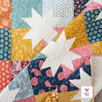 Star Pop II by Quilty Love Modern quilt draped