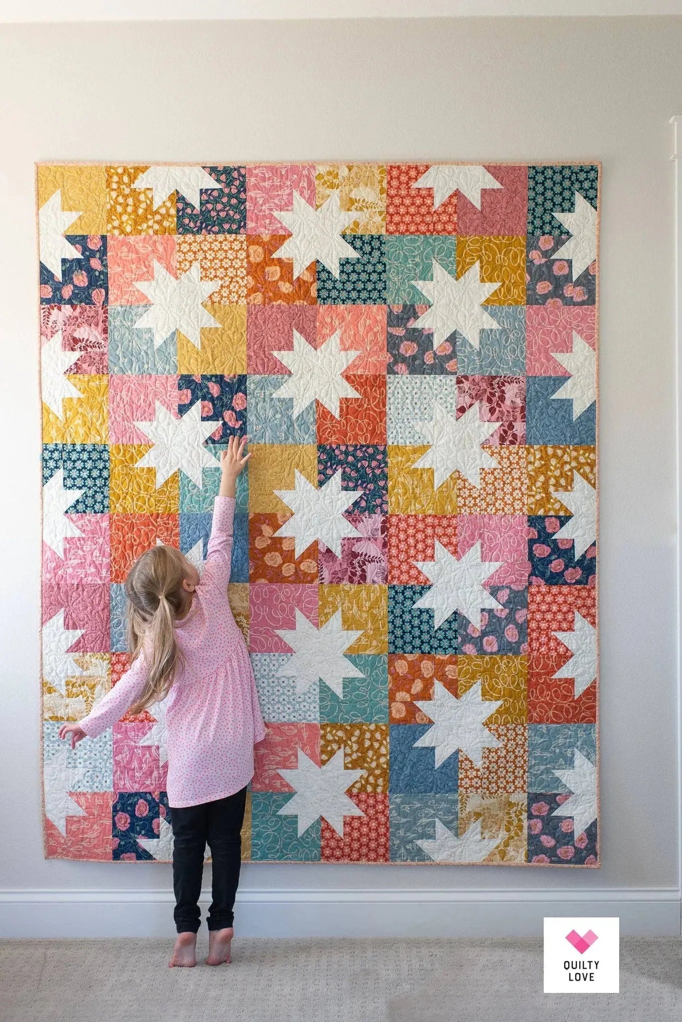 Modern Sawtooth Star quilt in scrappy fabrics - Star Pop II by Quilty Love