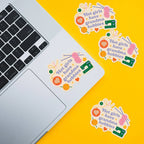 Laptop with 'Hot girls have grandma hobbies' stickers on a yellow background